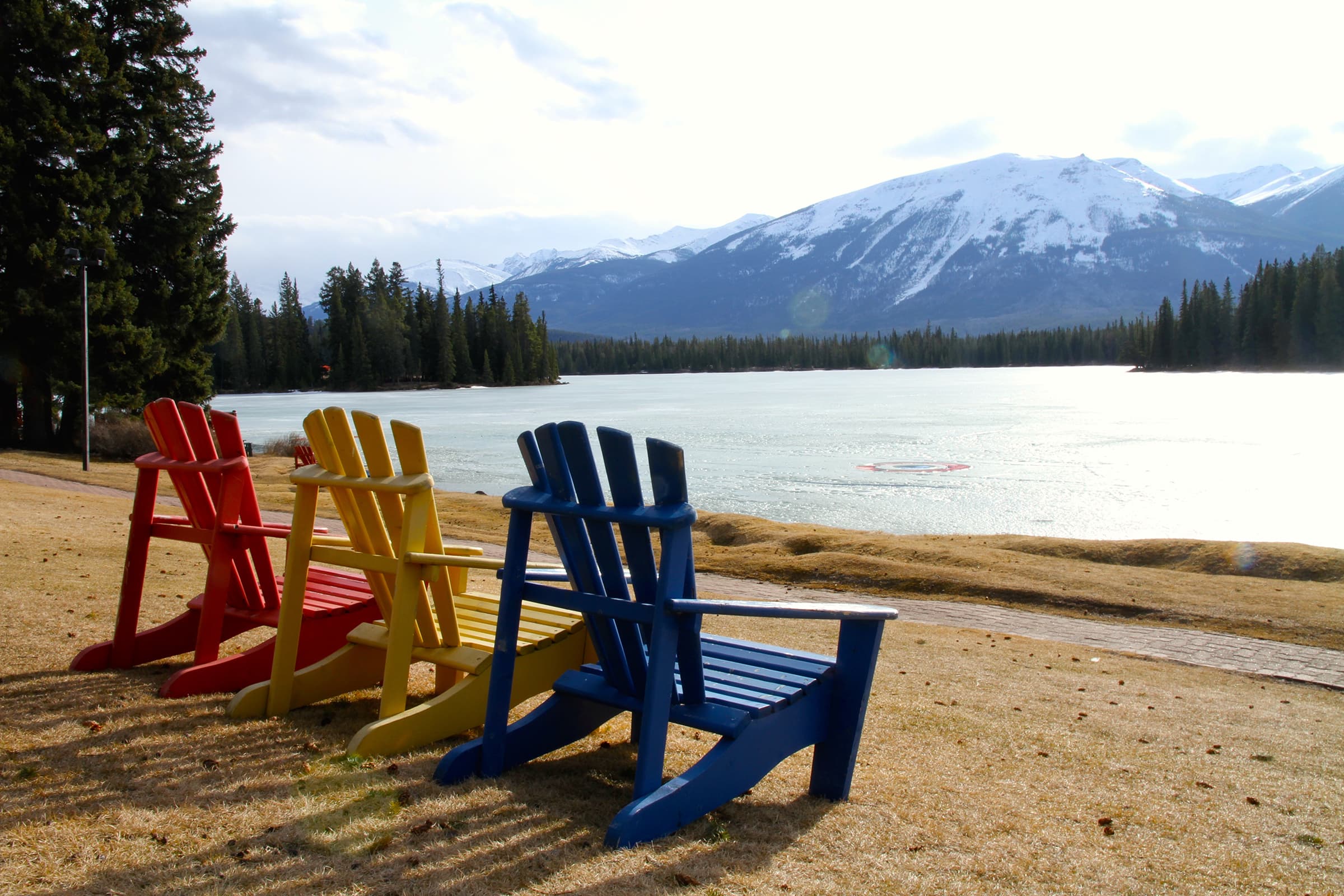 Three chairs at lake